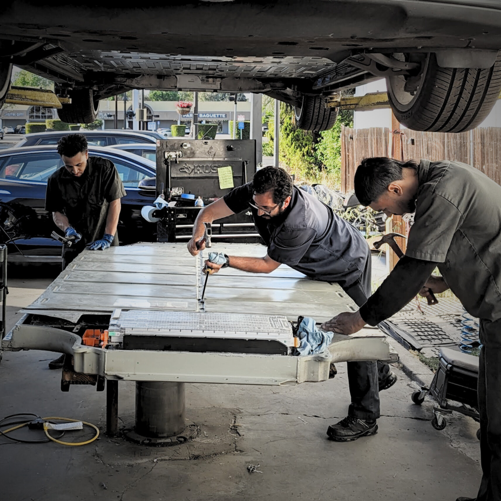 Overseeing Tesla high-voltage battery service with his EV repair team in Santa Clara