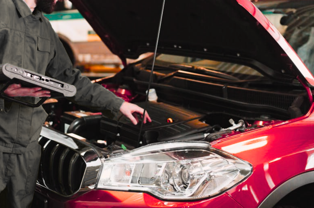 Under-the-hood inspection for hybrid and electric vehicles at Toyota and Tesla Service Center in Santa Clara, CA