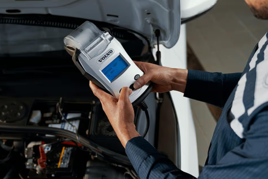 Battery, cables, and terminals inspection for hybrid and electric vehicles at Toyota and Tesla Service Center, Santa Clara, CA